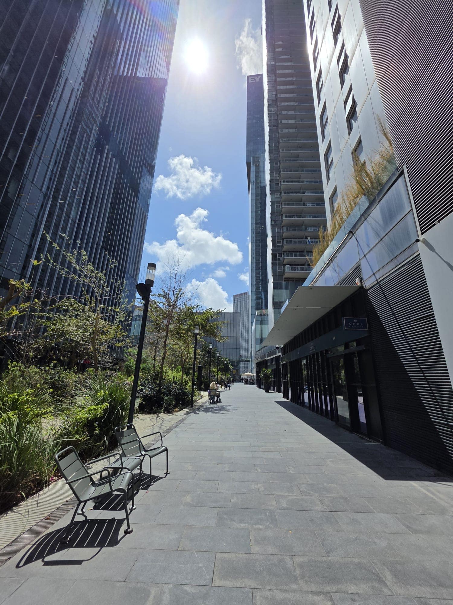 The Midtown complex promenade with green spaces and seating